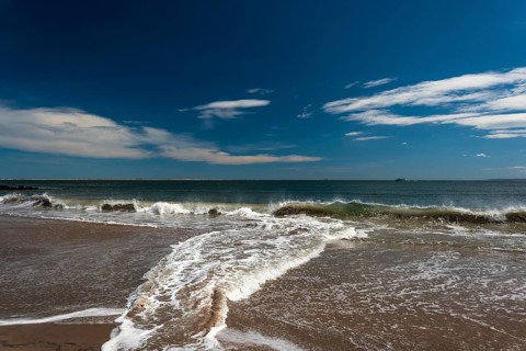 Listening to the ocean waves on a sunny spring day on the Brighton Beach