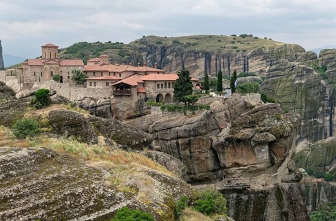 The Meteora Monastery Agia Triada Holy Trinity. The Greek Orthodox Meteora monasteries are built on sandstone cliffs above the Pinios valley. They are a UNESCO World Heritage Site. Kalambaka