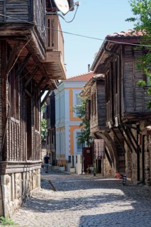 Half-timbered houses with typical roof overhang on the cobbled street in the old town. Sozopol
