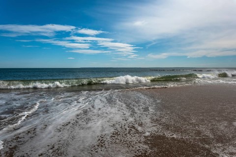 Listening to the ocean waves on a sunny spring day on the Brighton Beach