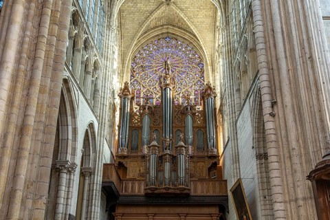 Church organ and rose window in the interior of Saint-Gatien Cathedral in Tours