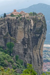 The Meteora Monastery Agia Triada Holy Trinity. The Greek Orthodox Meteora monasteries are built on sandstone cliffs above the Pinios valley. They are a UNESCO World Heritage Site. Kalambaka