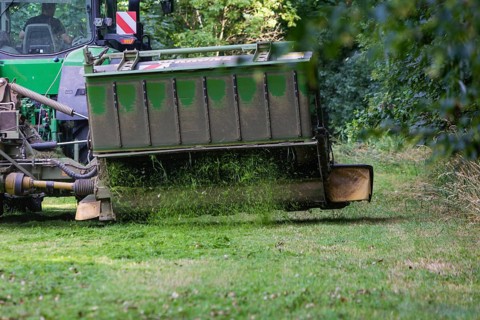 Grass mowing in a small field near Waldheim with a John Deere tractor
