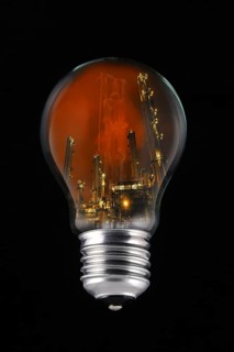 Lightning during thunderstorm above petrochemical industry inside incandescent lamp