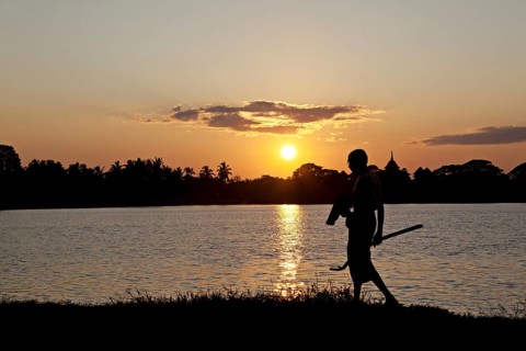 Man in sunset by the river