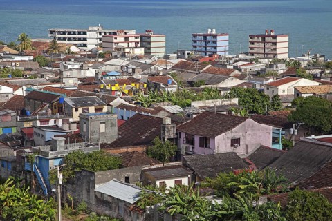 View over the city Baracoa with its apartments in Sovjet style and the Bay of Honey
