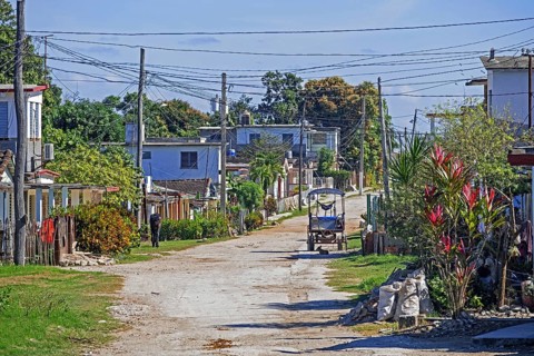 Dirt road running through rural village in the countryside of the Villa Clara Province on the island Cuba