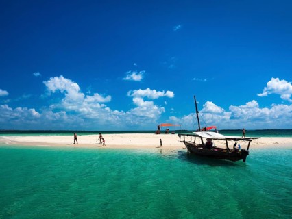 Boat and sandbank in the turquoise sea