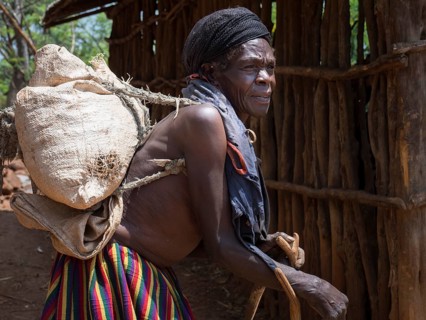 Old woman with sack on her back