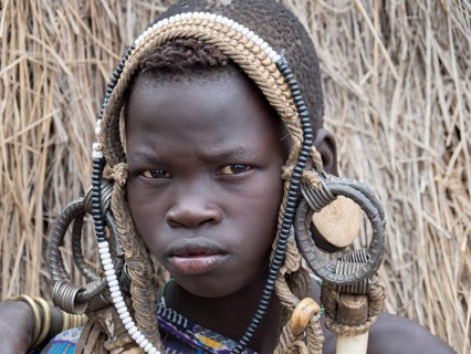 Boy from the Mursi tribe with headdress