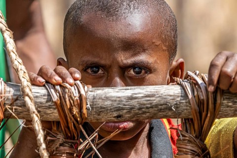 Child in the highlands at a Sing-Sing of the Melpa tribe