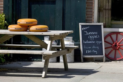 Cheese for sale outside in front of farm in Holland
