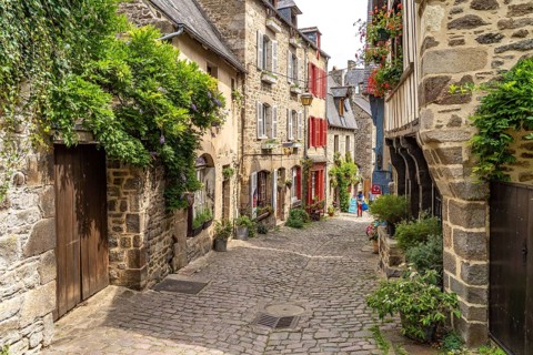 Alley with cobblestones in the historic old town of Dinan