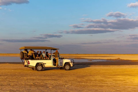 Safari Jeep with tourists at Salt Lake