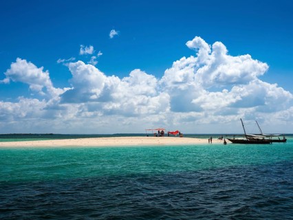 Boats and sandbank in the turquoise sea
