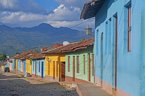 Colonial cobbled street with pastel coloured houses in the city Trinidad