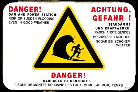 Warning sign for sudden flooding of river by dam from power station