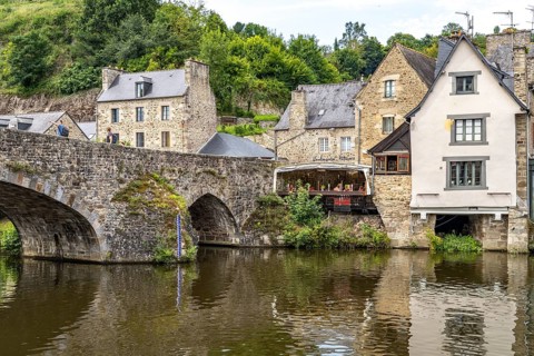 Medieval buildings and stone bridge on the river Rance in Dinan