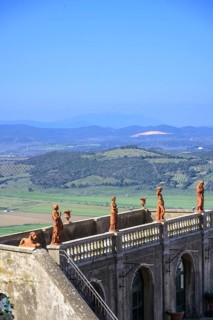 View over terracotta figures to wooded hills