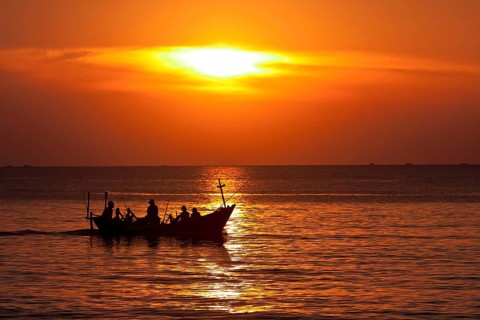 Boat in the sunset at the sea