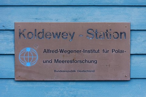 Sign with logo of the Koldewey Station for Arctic and marine research at Ny-Alesund on Svalbard