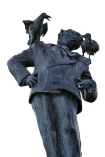 Statue of British filmmaker Alfred Hitchcock with seagulls on shoulders at Dinard