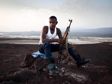 Man with rifle secures terrain
