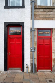 Two red front doors in the fishing village of Pittenweem