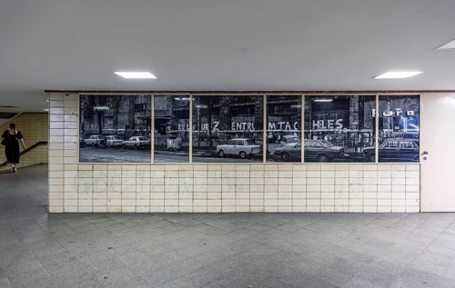 Oranienburger Strasse S-Bahn stop with historic photo of the former Tacheles department stores'