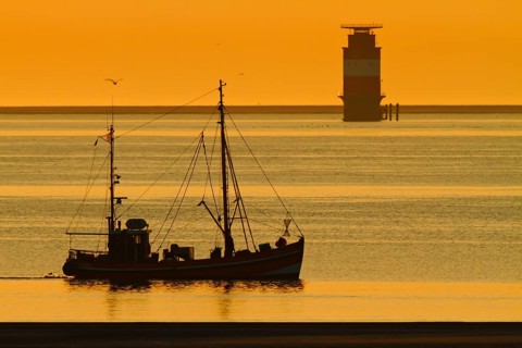 Crab cutter at sunrise in the Weser fairway off Minsener Oog