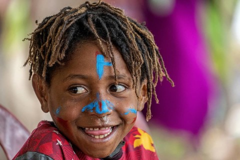 Child in the highlands at a Sing-Sing of the Melpa tribe