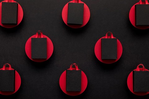Black shopping bags red dots top view