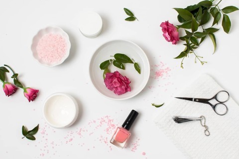Flat lay spa concept with nail polish rose