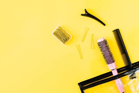Combs hairpins near cosmetics bag