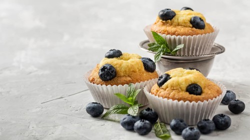 High view tasty cupcake with blueberry forest fruit