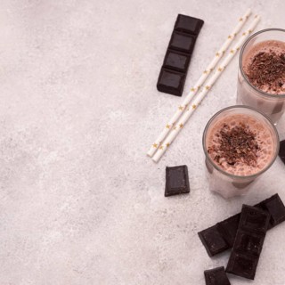 High angle milkshake glasses with chocolate