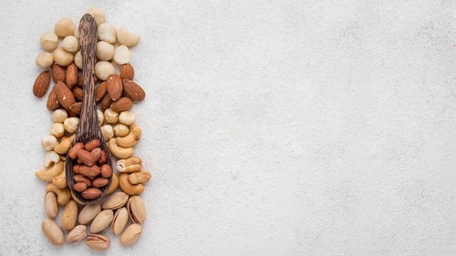 Different kinds nuts spoon copy space
