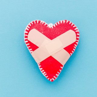 Bandage white stitch red heart shape blue background