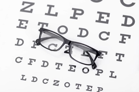 High angle pair glasses with letters