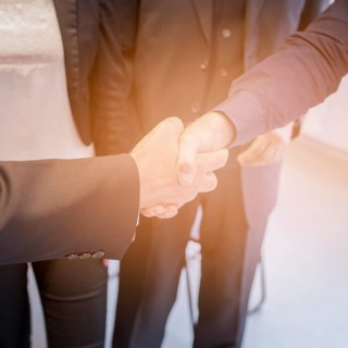 Overhead view two businessman shaking hands together