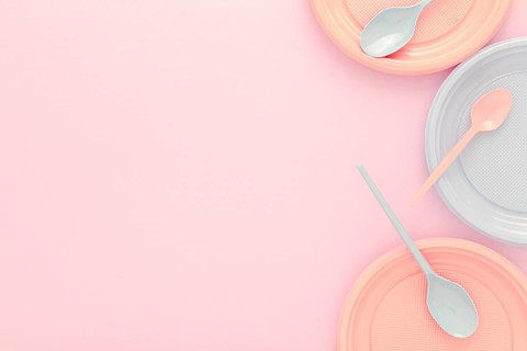 Flat lay plastic plates spoons