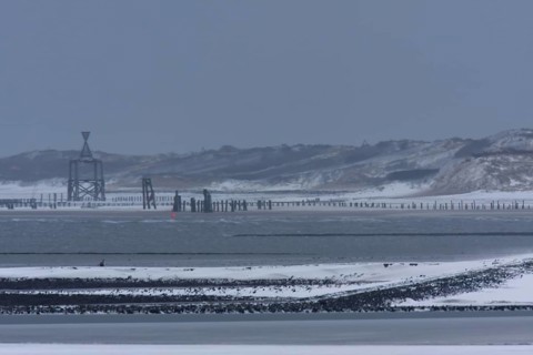 View from the island of Minsener Oog to Wangerooge in winter