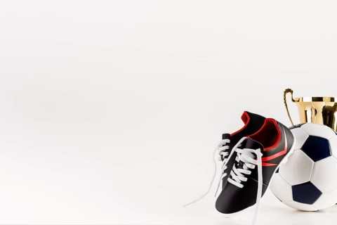 Football composition with shoes ball copyspace