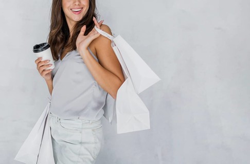 Happy woman undershirt with shopping nets coffee