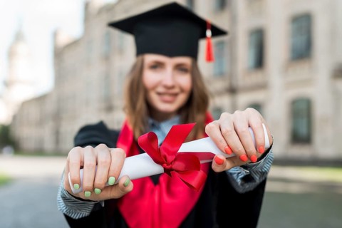 Graduation concept with portrait happy woman