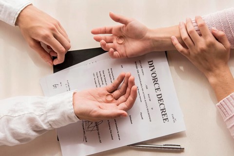 Hands with divorce decree close up