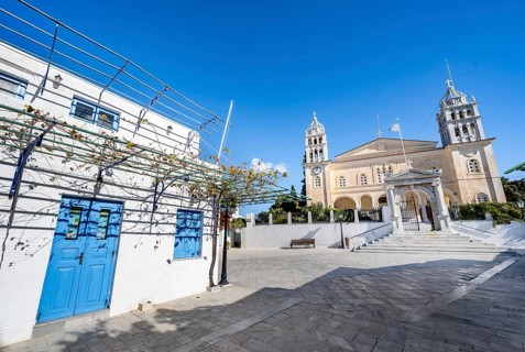 White Cycladic house and church Agia Triada