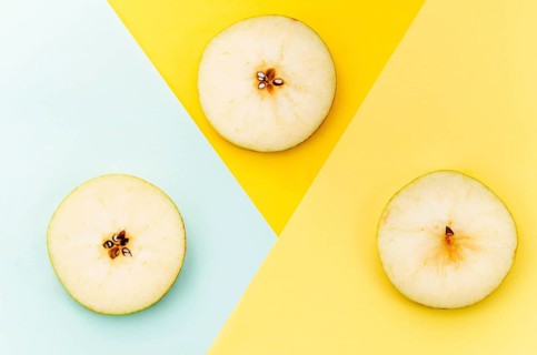 Sliced pear colored background