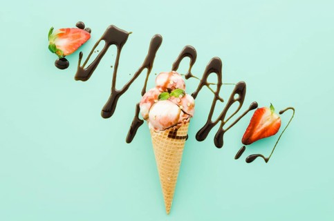 Ice cream waffle cone with chocolate syrup