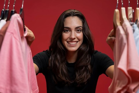Front view woman looking through clothes